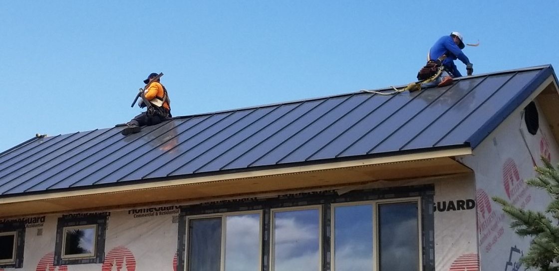 workers on metal roof